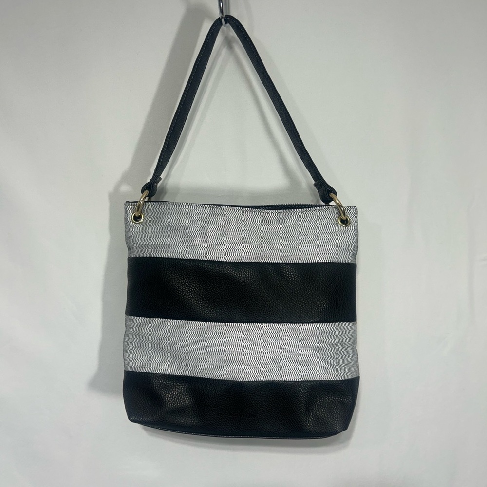 Stylish Black and white Women's Bag. Lined with packets and full zipper closure.